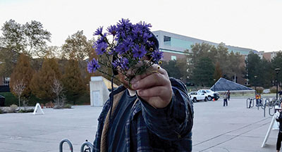 Person holding flowers